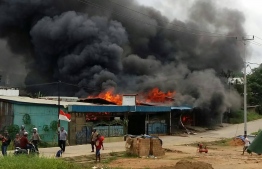 Several cities in Papua New Guinea were brought to a standstill, including Manokwari where businesses and the local parliament building were set ablaze by angry demonstrators. PHOTO: AFP