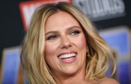 (FILES) In this file photo taken on July 20, 2019 US actress Scarlett Johansson arrives on stage for the Marvel panel in Hall H of the Convention Center during Comic Con in San Diego, California. - Superhero Black Widow is a woman at the top of her game, and so is the actress who plays her -- Scarlett Johansson is the world's highest paid actress for the second year in a row, according to Forbes's annual ranking published August 23, 2019. (Photo by VALERIE MACON / AFP)