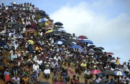 Rohingya refugees attend a ceremony organised to remember the second anniversary of a military crackdown that prompted a massive exodus of people from Myanmar to Bangladesh, at the Kutupalong refugee camp in Ukhia on August 25, 2019. - Some 200,000 Rohingya rallied in a Bangladesh refugee camp on August 25 to mark two years since they fled a violent crackdown by Myanmar forces, just days after a second failed attempt to repatriate the refugees. (Photo by MUNIR UZ ZAMAN / AFP)