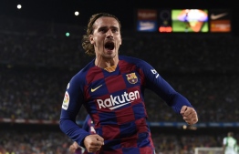 Barcelona's French forward Antoine Griezmann celebrates after scoring a second goal during the Spanish League football match between Barcelona and Real Betis at the Camp Nou stadium in Barcelona on August 25, 2019. (Photo by Josep LAGO / AFP)