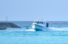 A speed launch traveling through the channel to enter an island's lagoon. PHOTO: HUSSAIN WAHEED/ MIIHAARU