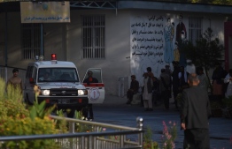 An ambulance is pictured outside Wazir Akbar Khan hospital as people wait after a massive explosion the night before in Kabul on September 3, 2019. - A massive explosion rocked central Kabul late on September 2, killing at least five people in a Taliban-claimed attack near an international complex while the US special envoy leading talks with the insurgents visited the Afghan capital. (Photo by WAKIL KOHSAR / AFP)