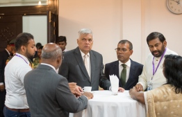 Sri Lanka Prime Minister Ranil Wickremesinghe (C) and Speaker of Parliament Mohamed Nasheed (R-3) after the PM addressed the Maldivian parliament. PHOTO/MAJILIS