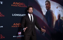 (FILES) In this file photo taken on August 20, 2019 Scottish actor Gerard Butler arrives for the Los Angeles premiere of "Angel Has Fallen" at the Regency Village theatre in Westwood, California. - Lionsgate's new action-packed political thriller "Angel Has Fallen" debuted atop the North American box office with an estimated $21.3 million in ticket sales, industry watcher Exhibitor Relations reported on August 25, 2019. "Angel," which stars Gerard Butler playing a Secret Service agent wrongly accused of trying to kill the president (Morgan Freeman), is the third film in the franchise. It also stars Nick Nolte, Piper Perabo and Jada Pinkett Smith. (Photo by VALERIE MACON / AFP)