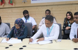 Director General of the Planning Ministry Shana Faarooq and MWSC Managing Director Adam Azim. signing the agreement. PHOTO: MINISTRY OF NATIONAL PLANNING AND INFRASTRUCTURE