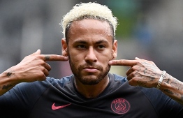(FILES) In this file photo taken on August 03, 2019 Paris Saint-Germain's Brazilian forward Neymar reacts at the end of the French Trophy of Champions football match between Paris Saint-Germain (PSG) and Rennes (SRFC) at the Shenzhen Universiade stadium. - Neymar is to stay at Paris Saint-Germain after seeing his desire to transfer back to Barcelona fail, according to press reports on September 1, 2019. "Se queda," Spanish for he's staying, read the L'Equipe headline on its front page with a photo of the Brazilian. PHOTO: FRANCK FIFE / AFP