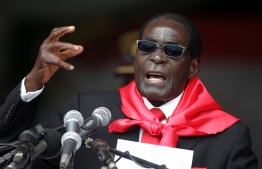 (FILES) In this file photo taken on February 23, 2014 Zimbabwe's then President Robert Mugabe talks during celebrations marking his 90th birthday in Marondera. - Robert Mugabe, who led Zimbabwe with an iron fist from 1980 to 2017, has died aged 95, Zimbabwe President Emmerson Mnangagwa announced September 6, 2019. (Photo by Jekesai NJIKIZANA / AFP)