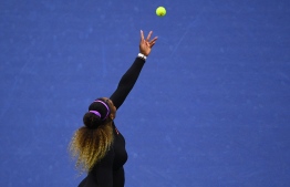 Serena Williams of the US serves to Elina Svitolina of Ukraine during their Singles Women's Semi-finals match at the 2019 US Open at the USTA Billie Jean King National Tennis Center in New York on September 5, 2019. (Photo by Johannes EISELE / AFP)