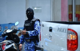 A police officer during the special operations conducted to aid the investigations of presidential Commission on Investigation of Murders and Enforced Disappearances. PHOTO: HUSSAIN WAHEED/ MIHAARU