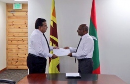 Foreign Minister Abdulla Shahid issues document of the new land area for the embassy of Sri Lanka. PHOTO/FOREIGN MINISTRY