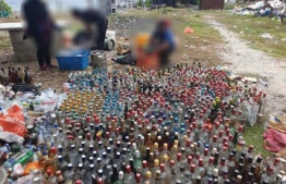 Maldives Police Service disposed of large quantities of alcohol at Dhoonidhoo, Kaafu Atoll, that were confiscated over 240 cases between 2008- 2014. PHOTO: POLICE