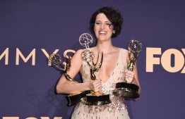 British actress Phoebe Waller-Bridge poses with the Emmy for Outstanding Writing for a Comedy Series, Outstanding Lead Actress In A Comedy Series and Outstanding Comedy Series for "Fleabag" during the 71st Emmy Awards at the Microsoft Theatre in Los Angeles on September 22, 2019. (Photo by Robyn Beck / AFP)