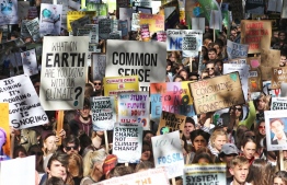 Photo taken at a protest held as part of the #ClimateStrike movement, which saw millions of people across the globe calling for governments and leaders to act on the impending effects of global warming and climate change/ FILE PHOTO