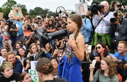 Swedish environment activist Greta Thunberg speaks at a climate protest outside the White House in Washington, DC on September 13, 2019. - Thunberg, 16, has spurred teenagers and students around the world to strike from school every Friday under the rallying cry "Fridays for future" to call on adults to act now to save the planet. (Photo by Nicholas Kamm / AFP)