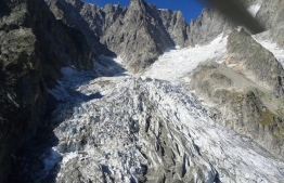 A handout image made available by the Courmayor Press office on September 20, 2019, shows the Planpincieux glacier on the Grandes Jorasses peak of the Mont Blanc massif Europe's highest mountain range, in the Italy’s Alpine region of Valle d’Aosta. The Courmayeur Mayor, Stefano Miserocchi, signed on September 24, 2019 an order to close the roads in the Val Ferret on the Italian side of Mont Blanc, after experts warned that a section, about 250,000 cubic metres of ice from the glacier, was sliding at speeds of 50-60cm per day and could collapse. "These phenomena once again show how the mountain is going through a period of major change due to climate factors and, therefore, it is particularly vulnerable," the mayor told to Italian media.
HO / COURMAYER Press Office / AFP
