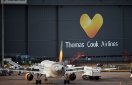 Thomas Cook passenger aircraft stand at on the tarmac outside the company's hangar at Manchester Airport in Manchester, northern England on Septmeber 23, 2019. British travel group Thomas Cook on Monday declared bankruptcy after failing to reach a last-ditch rescue deal, triggering the UK's biggest repatriation since World War II to bring back tens of thousands of stranded passengers. The 178-year-old operator, which had struggled against fierce online competition for some time and which had blamed Brexit uncertainty for a recent drop in bookings, was desperately seeking £200 million ($250 million, 227 million euros) from private investors to avert collapse. Oli SCARFF / AFP