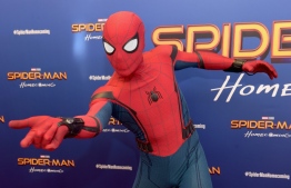 (FILES) In this file photo taken on June 26, 2017, Spiderman attends the "Spiderman: Homecoming" New York First Responders' Screening at Henry R. Luce Auditorium at Brookfield Place in New York City. - A breakdown in talks between Sony Pictures and Marvel had imperiled the web-slinger's celluloid future, but the two companies announced a deal on September 27, 2019 for Marvel Studios to produce the third Spidey film starring British actor Tom Holland. The film -- which follows up on "Spider-Man: Homecoming" and "Spider-Man: Far from Home" -- is set for release on July 16, 2021, the studios said. (Photo by Jason Kempin / GETTY IMAGES NORTH AMERICA / AFP)