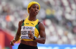Jamaica's Shelly-Ann Fraser-Pryce reacts after competing in the Women's 100m heats at the 2019 IAAF World Athletics Championships at the Khalifa International stadium in Doha on September 28, 2019. (Photo by Jewel SAMAD / AFP)