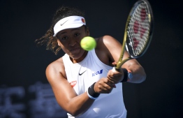 Naomi Osaka of Japan hits a return against Jessica Pegula of the US in their women's singles first round match at the WTA China Open tennis tournament in Beijing on September 29, 2019. (Photo by WANG ZHAO / AFP)