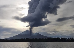 This handout picture taken and received courtesy of local resident Chris Lagisa on October 1, 2019 shows an ash cloud erupting from the Papua New Guinea's Mount Ulawun volcano. Papua New Guinea's volatile Ulawun volcano erupted early on October 1, sending a column of red lava shooting up into the sky and forcing the evacuation of recently returned residents.
Handout / COURTESY OF CHRISTOPHER LAGISA / AFP