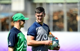 Ireland's head coach Joe Schmidt (L) speaks with Ireland's fly-half Jonathan Sexton  at a training session at the Steelers Training Ground in Kobe on October 1, 2019, during the Japan 2019 Rugby World Cup. (Photo by Filippo MONTEFORTE / AFP)
