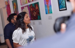 First Lady Fazna Ahmed observing the artwork displayed at In My Mind exhibition. PHOTO: PRESIDENT'S OFFICE