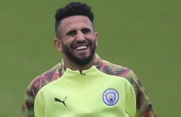 Manchester City's Algerian midfielder Riyad Mahrez reacts as he attends a team training session at City Football Academy in Manchester, north west England on September 30, 2019, the eve of their UEFA Champions League football Group C match against Dinamo Zagreb. (Photo by Lindsey Parnaby / AFP)