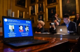 A computer screen displays the portraits of the laureates of the 2019 Nobel Prize in Physics (L-R) Canadian-American James Peebles, Swiss scientists Michel Mayor and Didier Queloz, at the Royal Swedish Academy of Sciences on October 8, 2019 in Stockholm. - Canadian-American James Peebles, Swiss scientists Michel Mayor and Didier Queloz on October 8, 2019 won the Nobel Physics Prize for their work in cosmology, the Royal Swedish Academy of Sciences said.
Peebles won one-half of the prize "for theoretical discoveries in physical cosmology," while Michel Mayor and Didier Queloz shared the other half "for the discovery of an exoplanet orbiting a solar-type star," professor Goran Hansson, secretary general of the academy, told a press conference. (Photo by Jonathan NACKSTRAND / AFP)