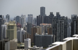 This photograph taken on August 19, 2019 shows an overview of highrise private condominiums in Singapore. - From luxury apartments in Singapore to Malaysian seafront condos, Hong Kongers are increasingly leaving the city to buy property in Southeast Asia, demoralised by increasingly violent protests as well as the China-US trade war. (Photo by Roslan RAHMAN / AFP) / 
