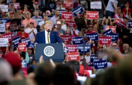 US President Donald Trump looks on during a "Keep America Great" rally at Sudduth Coliseum at the Lake Charles Civic Center in Lake Charles, Louisiana, on October 11, 2019. (Photo by SAUL LOEB / AFP)