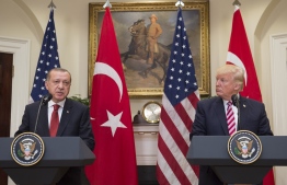 (FILES) In this file photo taken on May 16, 2017 US President Donald Trump and Turkish President Recep Tayyip Erdogan speak to the press in the Roosevelt Room of the White House in Washington, DC. - Facing a backlash for appearing to greenlight Turkey's assault against Kurdish forces in Syria, President Donald Trump on October 11, 2019 dialed up pressure on America's NATO ally by threatening crippling sanctions. (Photo by SAUL LOEB / AFP)