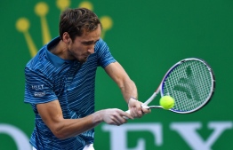 Daniil Medvedev of Russia hits a return against Stefanos Tsitsipas of Greece during their men's singles semi-final match at the Shanghai Masters tennis tournament in Shanghai on October 12, 2019. (Photo by HECTOR RETAMAL / AFP)
