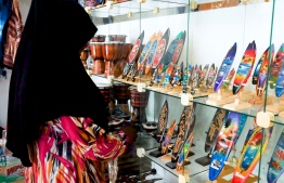 Zareena showcases some of the souvenir items on sale. PHOTO: HAWWA AMANY ABDULLA / THE EDITION