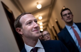 (FILES) In this file photo taken on September 19, 2019 Facebook CEO Mark Zuckerberg walks to meetings for technology regulations and social media issues on Capitol Hill, in Washington, DC. - Facebook chief executive Mark Zuckerberg will testify at the US House of Representatives this month on the social network's plan for a global digital currency, officials announced on October 9, 2019. The House Financial Services Committee said in a statement Zuckerberg would be the sole witness at the hearing on "An Examination of Facebook and Its Impact on the Financial Services and Housing Sectors." (Photo by Brendan Smialowski / AFP)