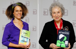 A combination of pictures created on October 15, 2019 shows British author Bernardine Evaristo (L) posing with her book 'Girl, Woman, Other' and Canadian author Margaret Atwood poses with her book 'The Testaments' during the photo call for the authors shortlisted for the 2019 Booker Prize for Fiction at Southbank Centre in London on October 13, 2019. Judges tore up the rule book on on October 14, awarding the prestigious Booker Prize for Fiction jointly to Margaret Atwood for "The Testaments" and Bernardine Evaristo for "Girl, Woman, Other". Atwood becomes only the second female author to win the award twice, sharing the £50,000 ($62,800, 60,000 euros) prize at the 50th anniversary ceremony at London's Guildhall.
Tolga AKMEN / AFP