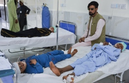 Children receive medical treatment in a hospital after being injured in a bomb blast in Alishang, Laghman province, on October 16, 2019. - At least three people were killed and about 20 children wounded when a Taliban truck bomb detonated near a rural police station and partially destroyed a nearby religious school, Afghan officials said. (Photo by NOORULLAH SHIRZADA / AFP)