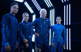 This November 5, 2020, illustration courtesy of Virgin Atlantic shows the spacesuit developed by Virgin Galactic in collaboration with the company’s Technical Spacewear Partner, Under Armour, for the world’s first commercial spaceflight pilot corps, according to a statement by Virgin Galactic.Third from the left stands Richard Branson, global business magnate and  founder of Virgin Galactic. PHOTO: Virgin Galactic / AFP