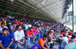 Undocumented workers seeking re-registration at the National Stadium. PHOTO: HUSSAIN WAHEED/ MIHAARU