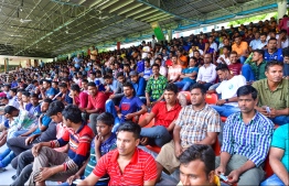 Expatriate workers queue up at the National Football Stadium in Male' for re-registration. FILE PHOTO: NISHAN ALI / MIHAARU