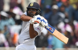 India's Rohit Sharma plays a shot during the first day of the third and final Test match between India and South Africa at the Jharkhand State Cricket Association (JSCA) stadium in Ranchi on October 19, 2019. (Photo by Money SHARMA / AFP) / 