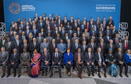 In this image released by the International Monetary Fund, Members of the International Monetary and Financial Committee (IMFC) pose for a group photograph October 19, 2019 at the IMF Headquarters during the 2019 IMF/World Bank Annual Meetings in Washington, DC. (Photo by Stephen JAFFE / AFP) / 