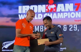 Prominent lawyer Hussain Shameem receives his qualification coin for the Ironman 70.3 World Championship 2020. PHOTO: MIHAARU FILES