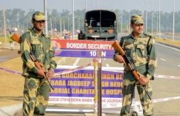 Border Security Force (BSF) personnel stand guard at Dera Baba Nanak, some 50 kms from Amritsar on October 24, 2019. India and Pakistan are set on October 24 to sign an agreement on the Kartarpur corridor which will be opened for Indian Sikh pilgrims to visit the Gurdwara Darbar Sahib, a religious site in the Pakistani town of Kartarpur near the Indian border.
NARINDER NANU / AFP