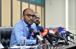 Finance Minister Ibrahim Ameer speaking at a press conference. PHOTO: HUSSAIN WAHEED / MIHAARU