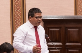 Minister of Environment Dr Hussain Rasheed Hassan speaks at a parliament sitting. PHOTO/MAJILIS