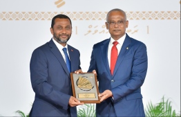 President Solih presents National Award of Recognition to Ahmed Afaal, for his contributions in health sector development. PHOTO: HUSSAIN WAHEED / MIHAARU
