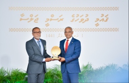 President Solih presents National Award of Honour to Sayyid Ali, for his contributions to sports in sportsmanship and sports development. PHOTO: HUSSAIN WAHEED / MIHAARU