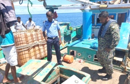 Maldives Police Service and Maldives' Coastguard operating on the seized Iran flagged vessel. PHOTO: MALDIVES NATIONAL DEFENCE FORCE (MNDF) 