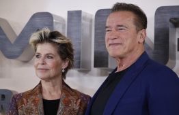(FILES) In this file photo taken on October 17, 2019 Austrian-US actor Arnold Schwarzenegger (R) and US actress Linda Hamilton (L) pose during a photo call to promote the film Terminator: Dark Fate in London. - "Terminator: Dark Fate" opened atop the North American box office this weekend with a take of $29 million, industry watcher Exhibitor Relations said Monday, but analysts said that figure fell far below expectations. (Photo by Tolga AKMEN / AFP)