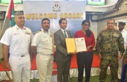 Minister of Defence Mariya Ahmed Didi formally accepting the donation of ammunition from Indian Ambassador to Maldives Sunjay Sudhir. PHOTO: MINISTRY OF DEFENCE